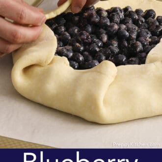 A blueberry galette being folded before baking.