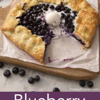 A blueberry galette with a piece removed.