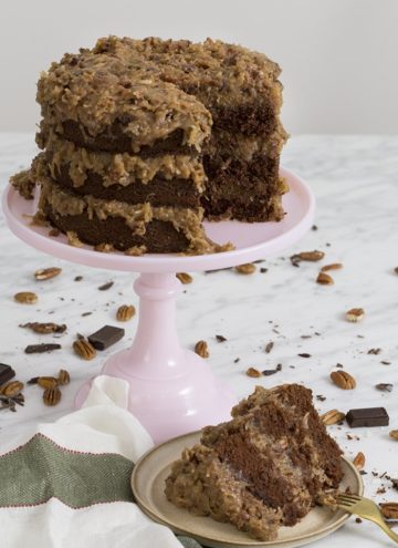 a phopto of a german chocolate cake with a piece cut out.