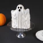 A photo of a ghost made out of vanilla cake.