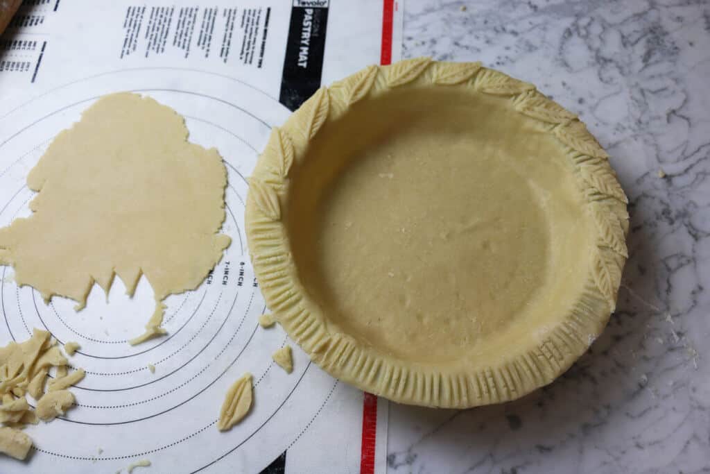 A photo of pie crust being decorated.