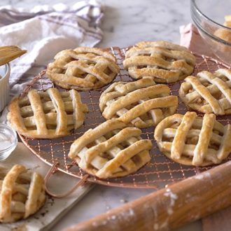Mini apple pies fresh out of the oven.