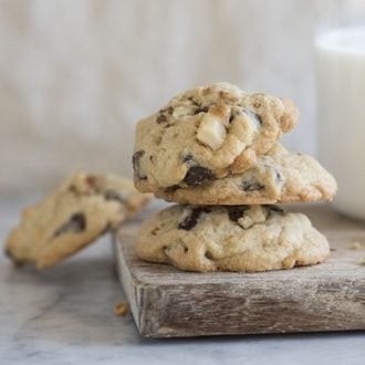 chocolate chip cookies next to a glass of milk