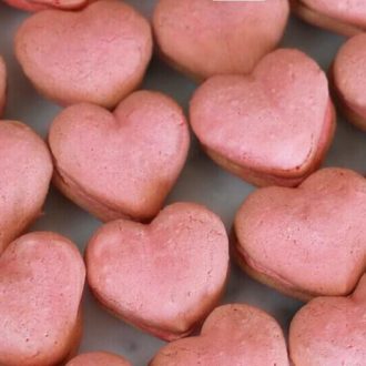 A photo showing a bunch of Heart-Shaped Macarons.
