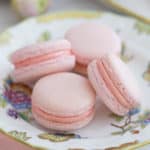 soft pink macarons on a hand painted porcelain plate