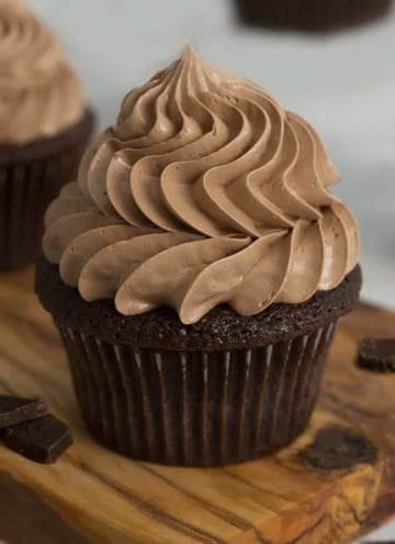 A chocolate cupcake topped with a swirl of chocolate buttercream