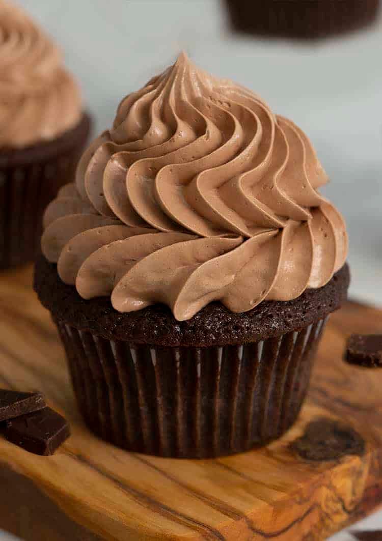 A chocolate cupcake topped with a swirl of chocolate buttercream