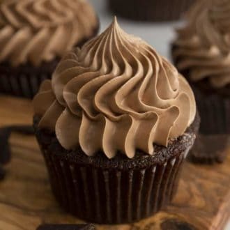 a chocolate cupcake crowned with a giant dollop of buttercream