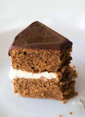 A piece of chocolate marzipan cake with chocolate ganache