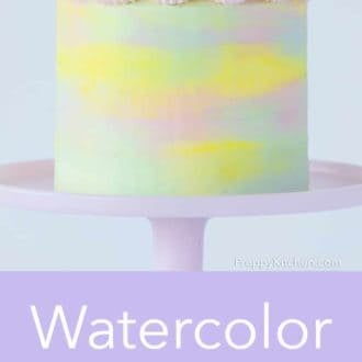 three layer cake with watercolor decoration on a cake stand