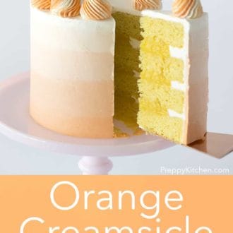 three layer orange creamsicle cake with orange to white ombre decoration