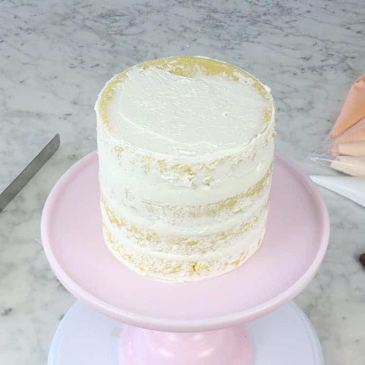 A crumb coated cake ready for final decorations.