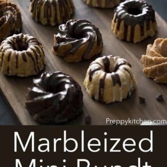 marbelized mini bundt cakes on a dark wood serving board
