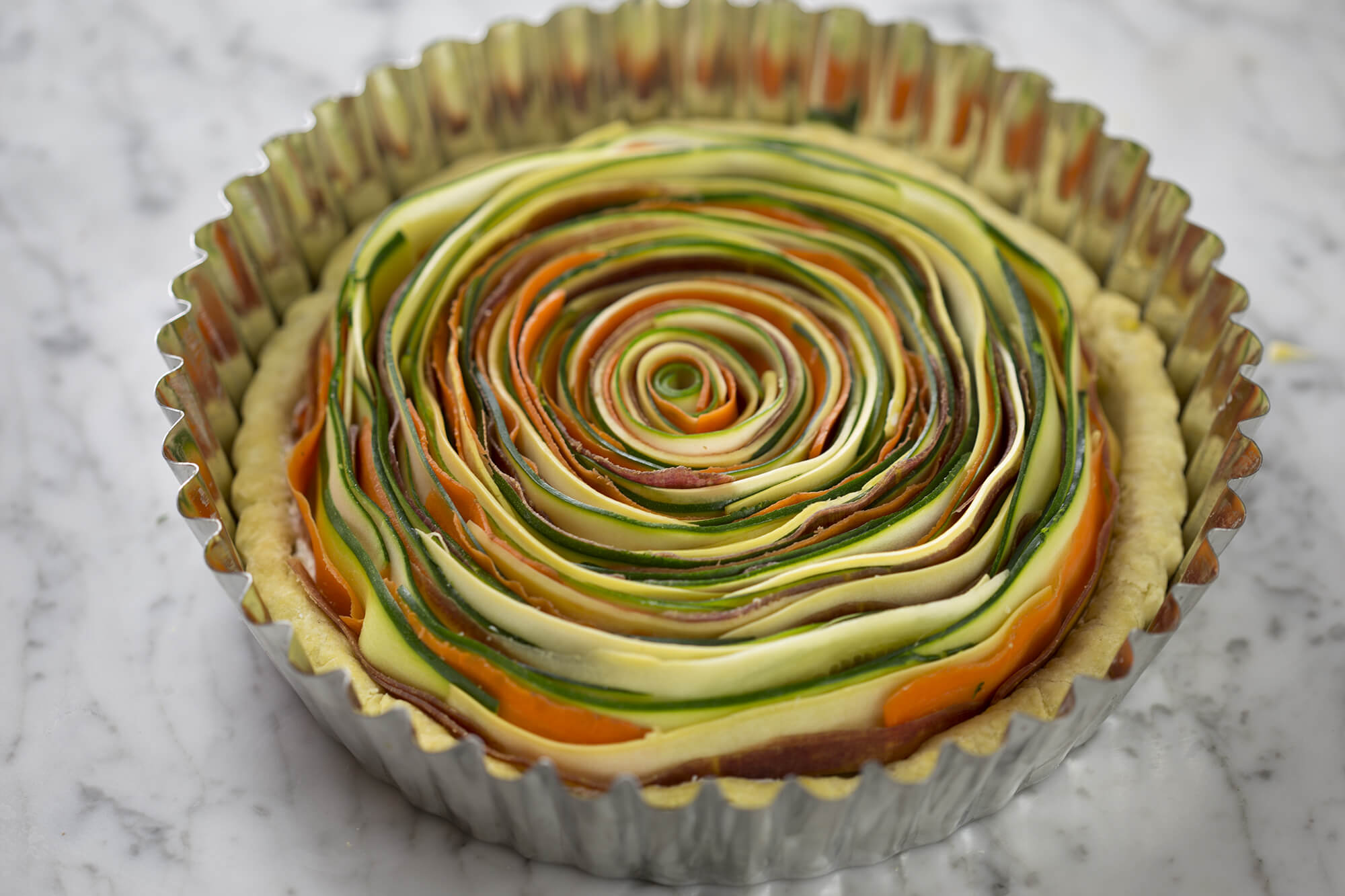 Photo of vegetable tart with completed spiral 