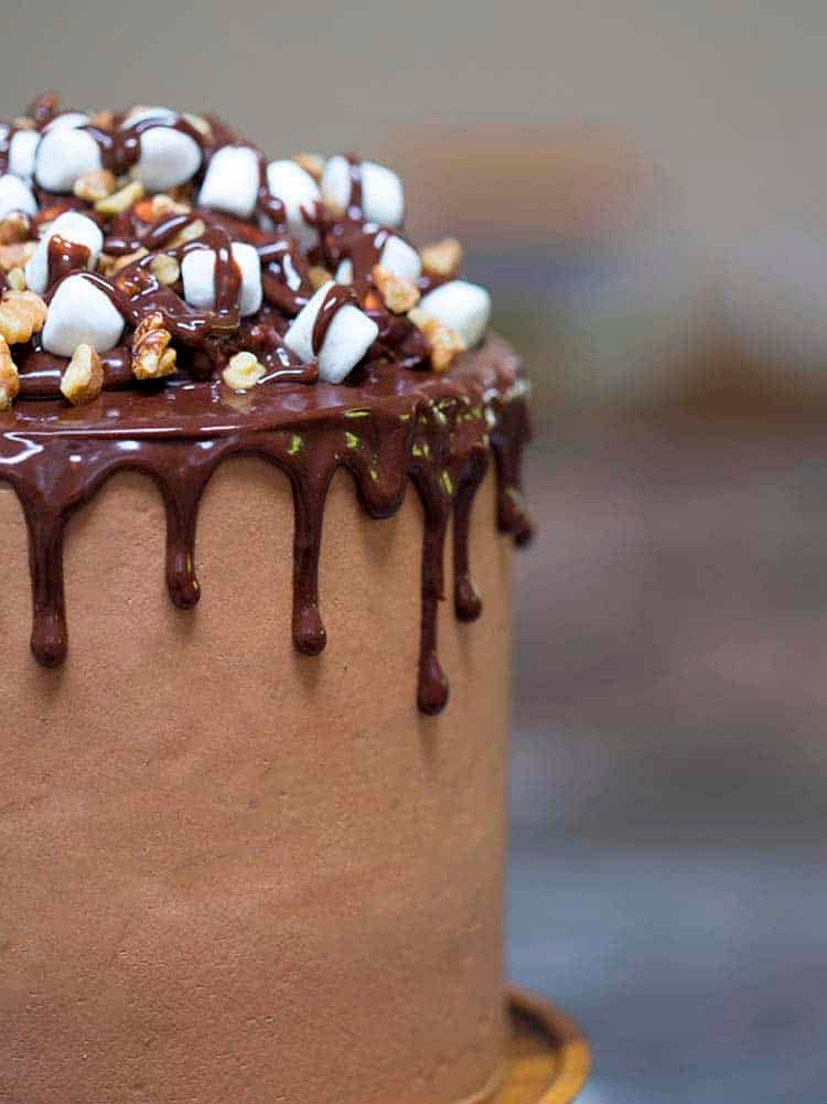 a rocky road cake with a chocolate drip