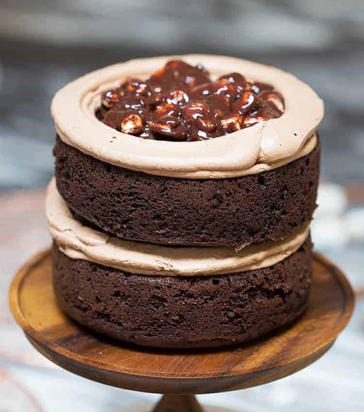 A Rocky Road Cake partially constructed showing the filling inside.