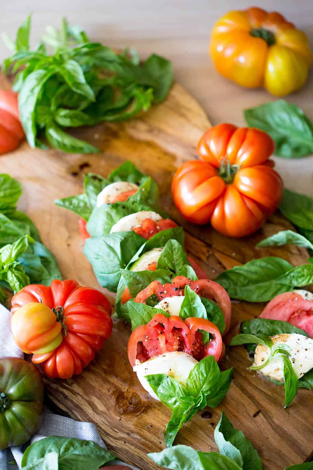 A photo of a delicious caprese salad on a serving board.