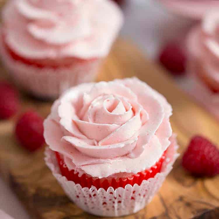 vanilla cupcakes with roses piped from raspberry buttercream