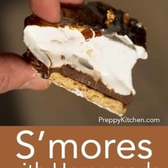 fingers holding a piece of homemade smores