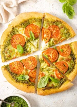 An overhead shot of a pizza cut into slices
