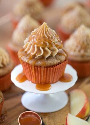 Caramel apple cupcake on a small cake stand.