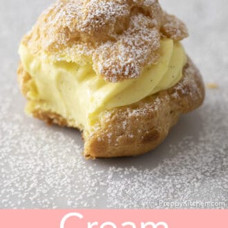 A cream puff with a bite taken out