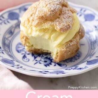 Pinterest graphic of a cream puff with a bite taken out with powdered sugar dusted on top.