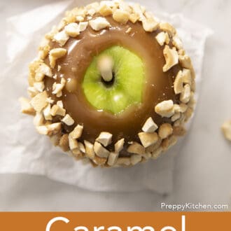 Pinterest graphic of an overhead view of a caramel apple rolled in chopped peanuts.