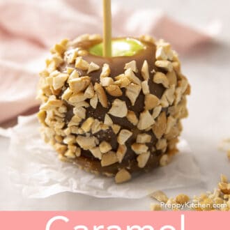 Pinterest graphic of a caramel apple coated in chopped peanuts.