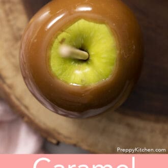 Pinterest graphic of an overhead view of a caramel apple on a wooden serving board.