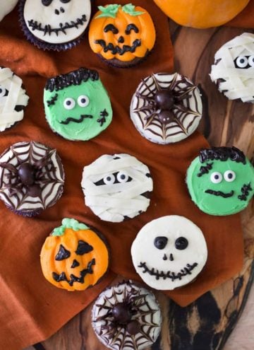 photo of different types of Halloween Cupcakes on a wooden background