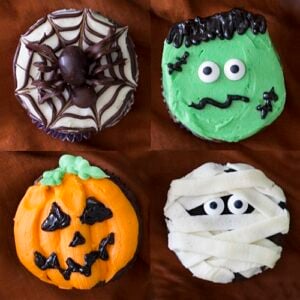 photo showing four different halloween cupcakes, mummy, frankenstein, jack o'lanterns and a spider on a web.