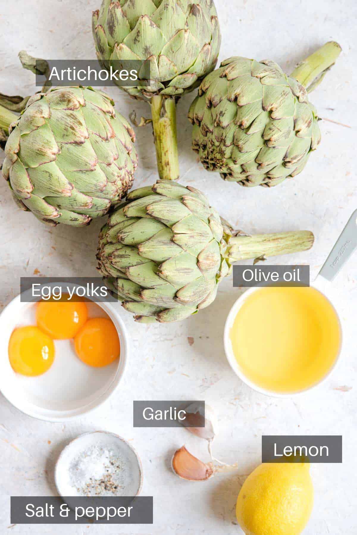 An overhead shot of all the ingredients you need to make roasted artichokes