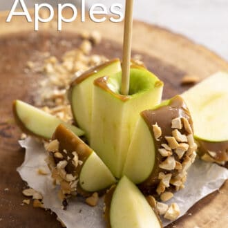 Pinterest graphic of a caramel apple coated in peanuts chopped.