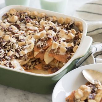 sweet potato casserole ina green and white dish