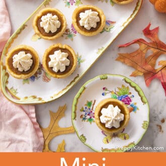 Seven mini pumpkin pies with whipped cream.
