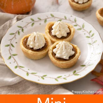 Three mini pumpkin pies on a porcelain plate.