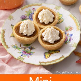 Three mini pumpkin pies on a small plate.