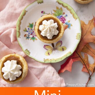 Mini pumpkin pies next to a pink napkin.