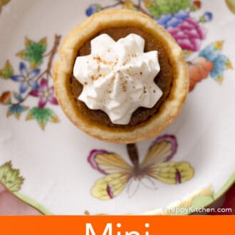 A mini pumpkin pie on a porcelain plate.