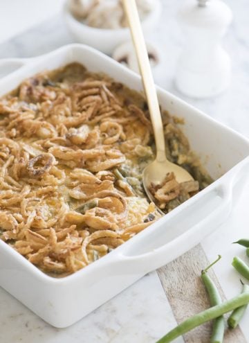 Photo of a green bean casserole in a white serving dish