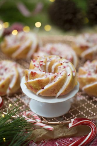 A photo of a peppermint mini bundt cake on a cake plate.