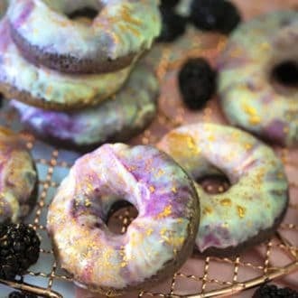 A photo of Blackberry Donuts with golden flacks