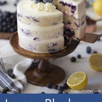 three layered lemon blueberry cake with white frosting