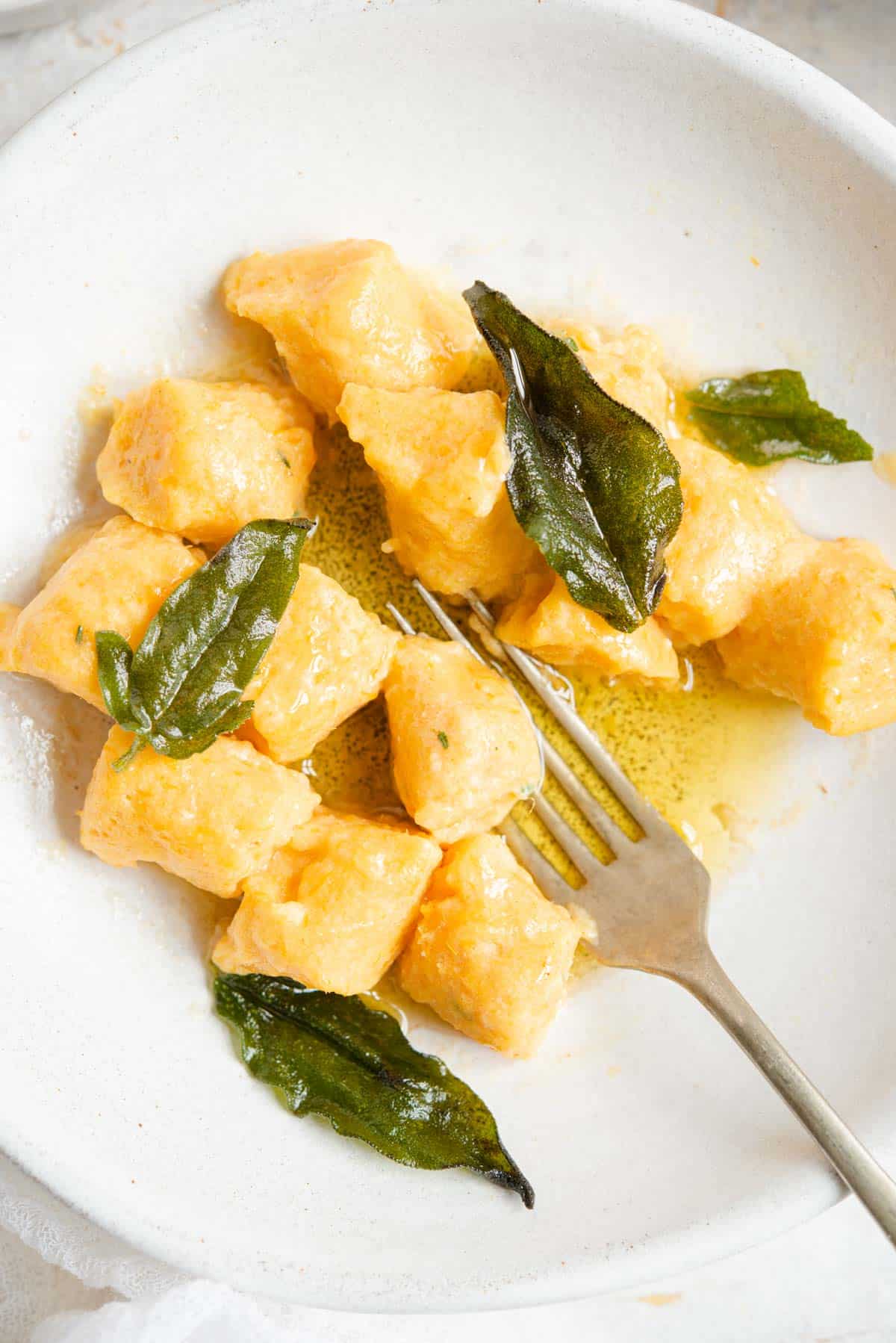 An overhead shot of sweet potato gnocchi with brown butter and sage