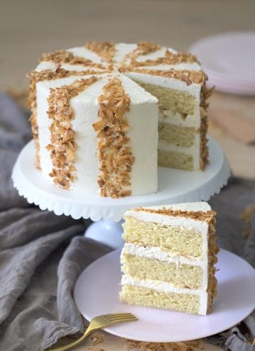 photo of a cocobut cake with toasted coconut flake stripes.