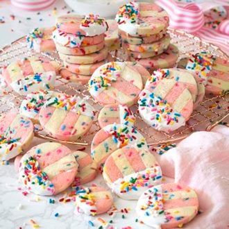 photo of pink and white Funfetti Cookies on a copper wire rack.