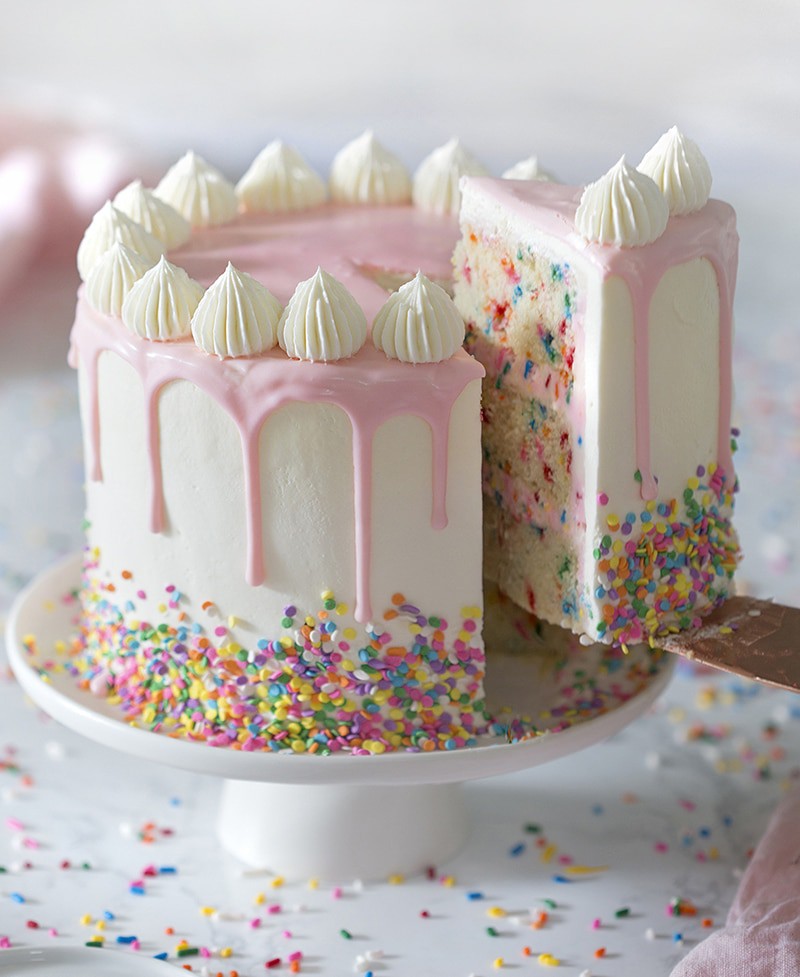 Funfetti Cake with a piece being removed