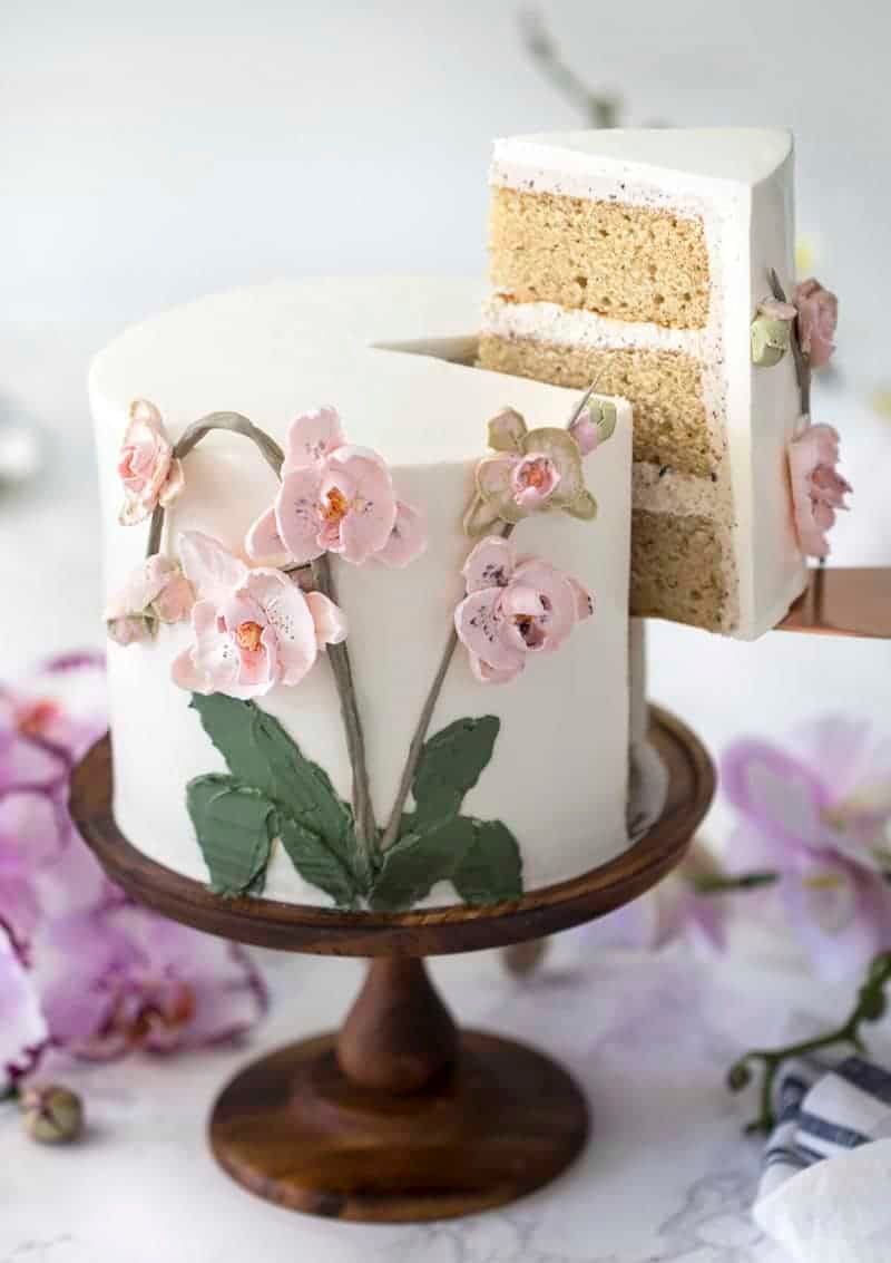 photo of a brown butter Cake on a wooden cake stand