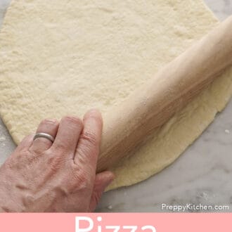 Rolling out pizza dough.